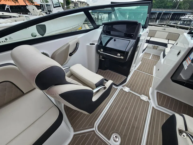 Slide: The Image of 2023 Monterey M-65 boat interior with sleek seating and modern dashboard design. - 12