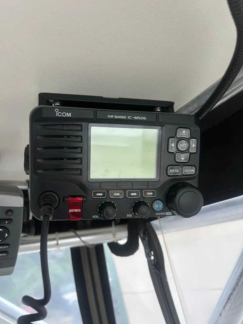 Slide: The Image of ICOM marine radio installed in a 1998 Carolina Classic 25 Express boat. - 11