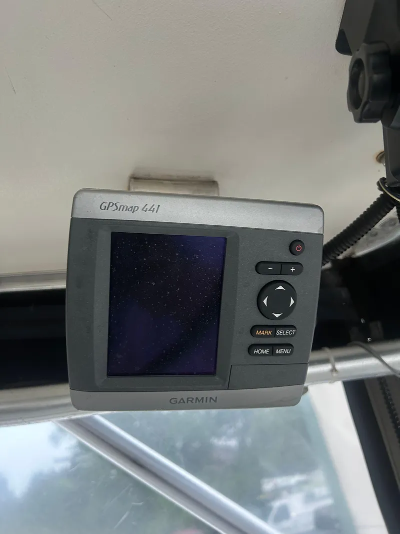 Slide: The Image of Garmin GPSmap 441 on 1998 Carolina Classic 25 Express boat dashboard. - 12