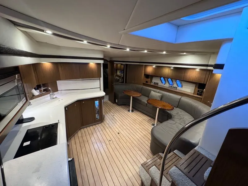 Slide: The Image of Luxurious interior of 2014 Cruisers Yachts 540 SC with modern kitchen and seating area. - 5