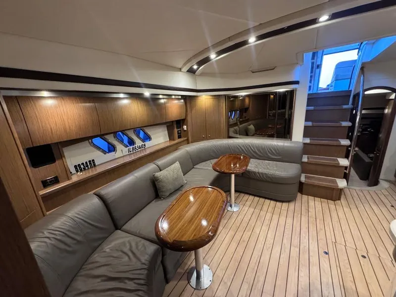 Slide: The Image of Luxurious 2014 Cruisers Yachts 540 SC interior with elegant wood finish and plush seating. - 6