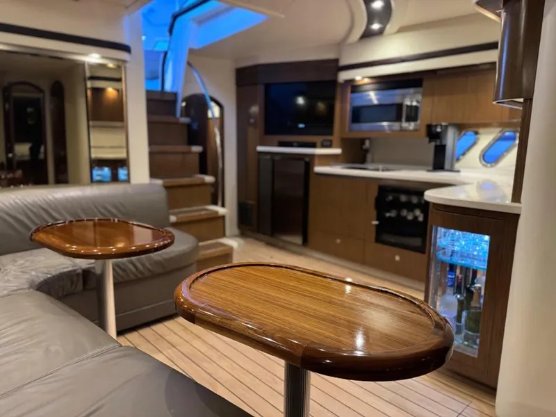 Slide: The Image of Luxurious interior of 2014 Cruisers Yachts 540 SC with modern kitchen and seating area. - 8