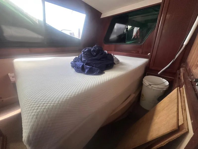 Slide: The Image of Interior cabin of 1989 Bluewater 51' Coastal Cruiser with bed and windows. - 23