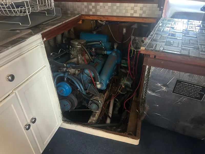 Slide: The Image of Engine compartment of a 1989 Bluewater 51' Coastal Cruiser, showcasing mechanical components. - 36