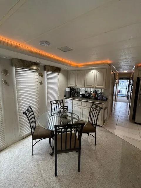 Slide: The Image of Interior of 2000 Funtime 16x72 houseboat with dining area and kitchen. - 7