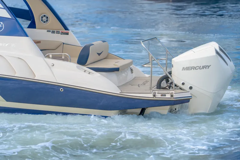 Slide: The Image of 2025 Hanover 305 Outboard boat with Mercury engine on water. - 9