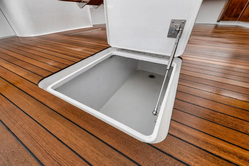 Slide: The Image of Open hatch on teak deck of 2011 Jim Smith Custom Sportfish boat. - 16
