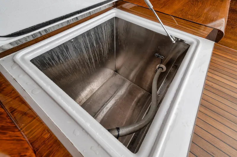 Slide: The Image of Stainless steel storage compartment on 2011 Jim Smith Custom Sportfish boat. - 18