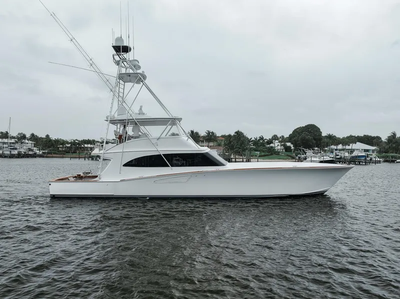 Slide: The Image of 2011 Jim Smith Custom Sportfish yacht on calm water, side view. - 2