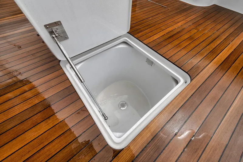 Slide: The Image of Open hatch on Jim Smith 2011 Custom Sportfish boat with teak deck. - 20