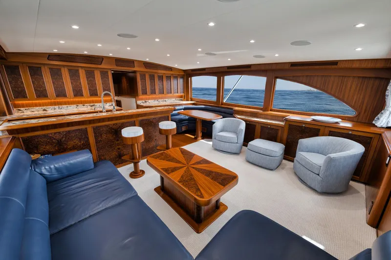 Slide: The Image of Luxurious interior of 2011 Jim Smith Custom Sportfish yacht with elegant wood finishes and ocean view. - 23