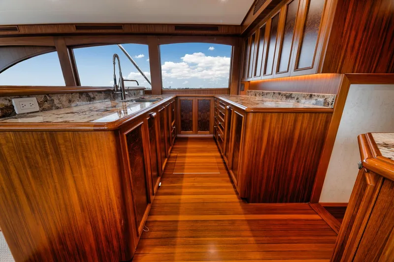 Slide: The Image of Luxurious wooden interior of 2011 Jim Smith Custom Sportfish yacht with marble countertops. - 30