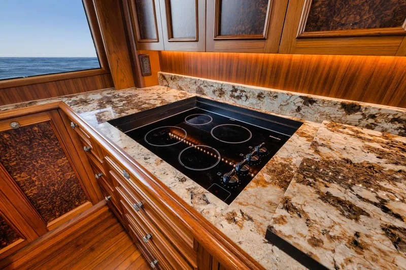 Slide: The Image of Luxurious kitchen on 2011 Jim Smith Custom Sportfish yacht with marble countertops and ocean view. - 36