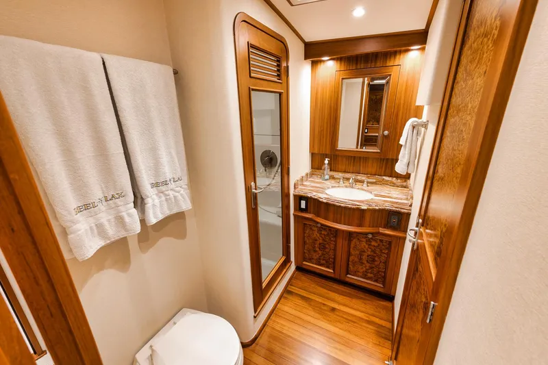 Slide: The Image of Luxurious bathroom in 2011 Jim Smith Custom Sportfish yacht with wooden accents and modern fixtures. - 40