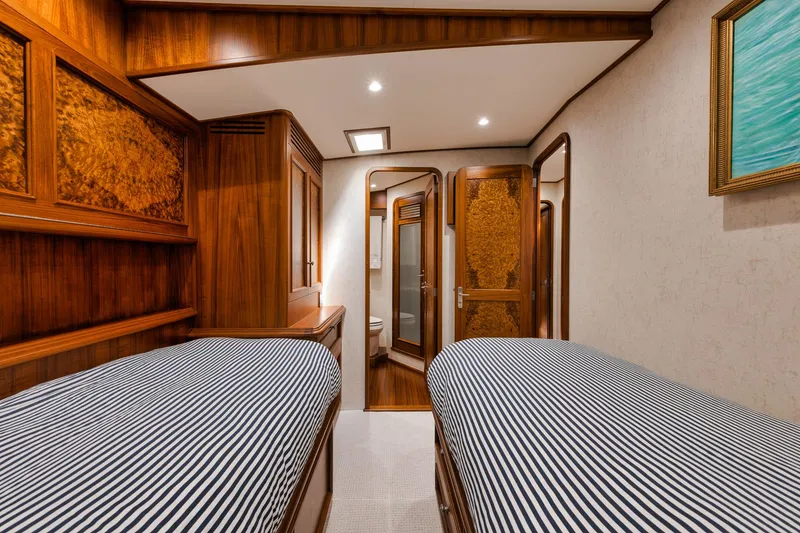 Slide: The Image of Luxurious 2011 Jim Smith Custom Sportfish cabin with twin beds and elegant wood finishes. - 42