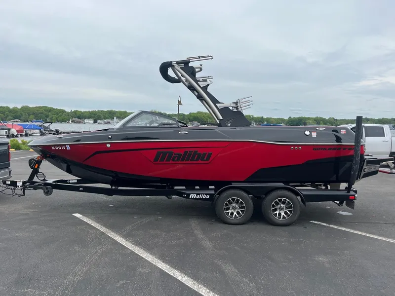 The Image of 2022 Malibu Wakesetter 23 LSV boat on trailer in parking lot. - 1