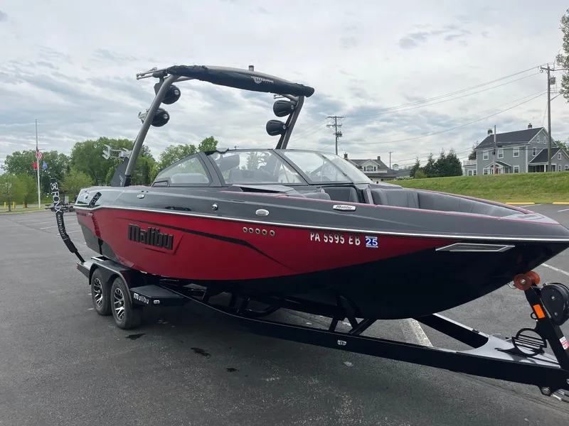 Slide: The Image of 2022 Malibu Wakesetter 23 LSV boat on trailer, parked outdoors. - 3