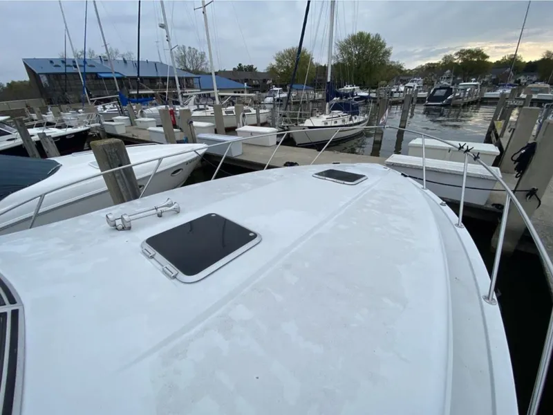 Slide: The Image of 1987 Chris-Craft 320 Amerosport docked at marina, surrounded by other boats. - 10