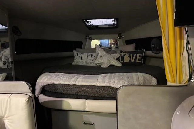 Slide: The Image of Cozy cabin interior of 1987 Chris-Craft 320 Amerosport with plush bedding and decorative pillows. - 24