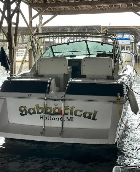 Slide: The Image of 1987 Chris-Craft 320 Amerosport boat docked, named "Sabbatical," in Holland, MI marina. - 3