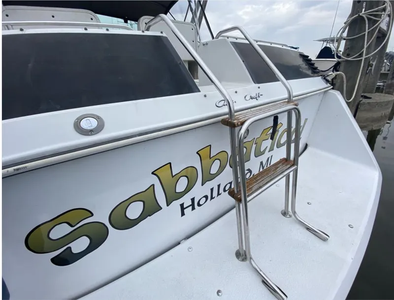 Slide: The Image of 1987 Chris-Craft 320 Amerosport boat with ladder, docked in Holland, Michigan. - 4