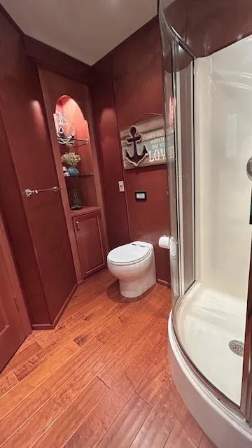 Slide: The Image of Bathroom interior of 2007 Sharpe 18 x 85 houseboat with shower and wooden decor. - 12