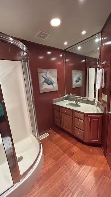 Slide: The Image of Luxurious 2007 Sharpe houseboat bathroom with wood accents and modern shower. - 13