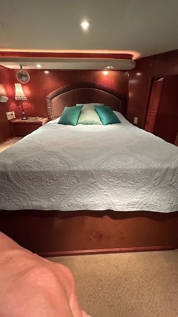 Slide: The Image of Luxurious bedroom interior of 2007 Sharpe 18 x 85 houseboat with elegant bedding and warm lighting. - 16