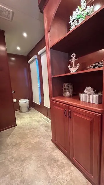 Slide: The Image of Luxurious 2007 Sharpe houseboat interior with wooden cabinetry and modern bathroom. - 17
