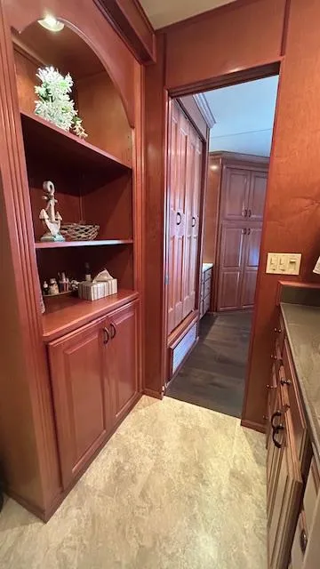 Slide: The Image of Luxurious wood interior of a 2007 Sharpe 18 x 85 houseboat with elegant cabinetry. - 18