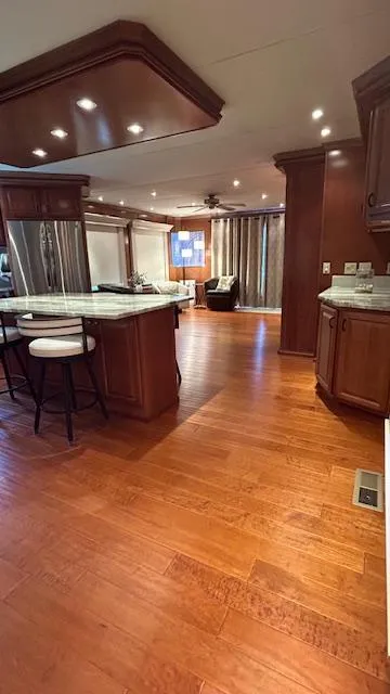Slide: The Image of Luxurious interior of a 2007 Sharpe 18 x 85 houseboat with wooden flooring and modern furnishings. - 6