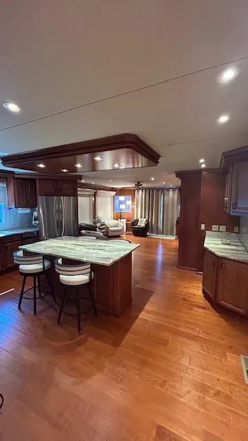 Slide: The Image of Luxurious interior of a 2007 Sharpe 18 x 85 houseboat with modern kitchen and seating area. - 7