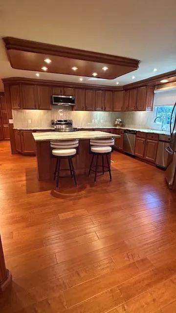 Slide: The Image of Luxurious kitchen in 2007 Sharpe 18 x 85 houseboat with wooden flooring and modern amenities. - 8