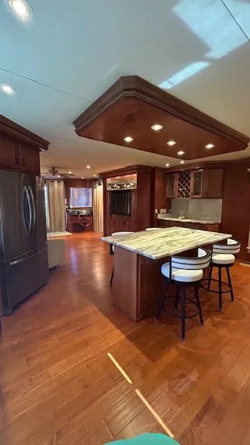 Slide: The Image of Luxurious kitchen interior of 2007 Sharpe 18 x 85 houseboat with modern appliances and wooden flooring. - 9