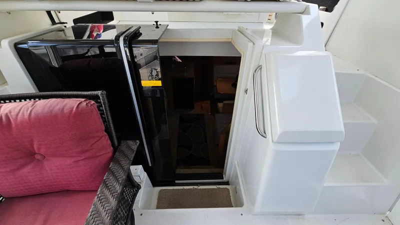 Slide: The Image of 1995 Carver 355 Aft Cabin interior with stairs and seating area. - 12