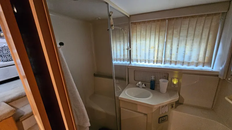 Slide: The Image of Bathroom interior of 1995 Carver 355 Aft Cabin yacht with shower and sink. - 26