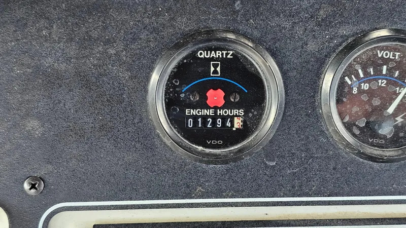 Slide: The Image of 1995 Carver 355 Aft Cabin engine hour meter showing 1,294 hours. - 11