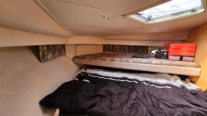 Slide: The Image of 1995 Carver 355 Aft Cabin interior with cozy sleeping area and overhead window. - 20