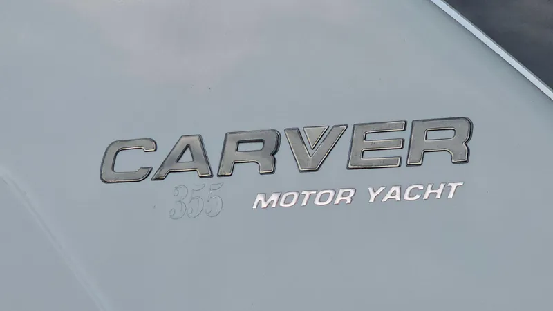 Slide: The Image of 1995 Carver 355 Aft Cabin Motor Yacht logo on hull. - 27