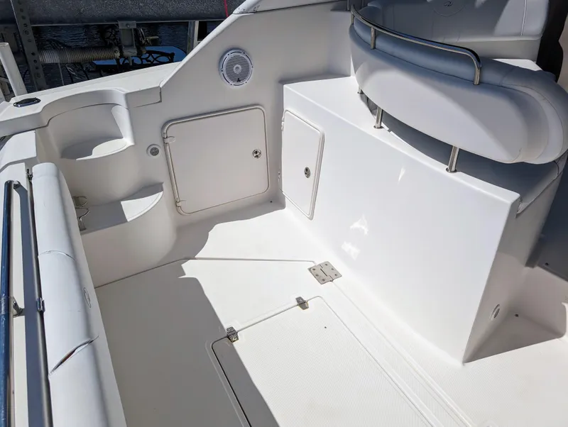 Slide: The Image of 2005 Regal 3560 boat interior with seating and storage compartments. - 12