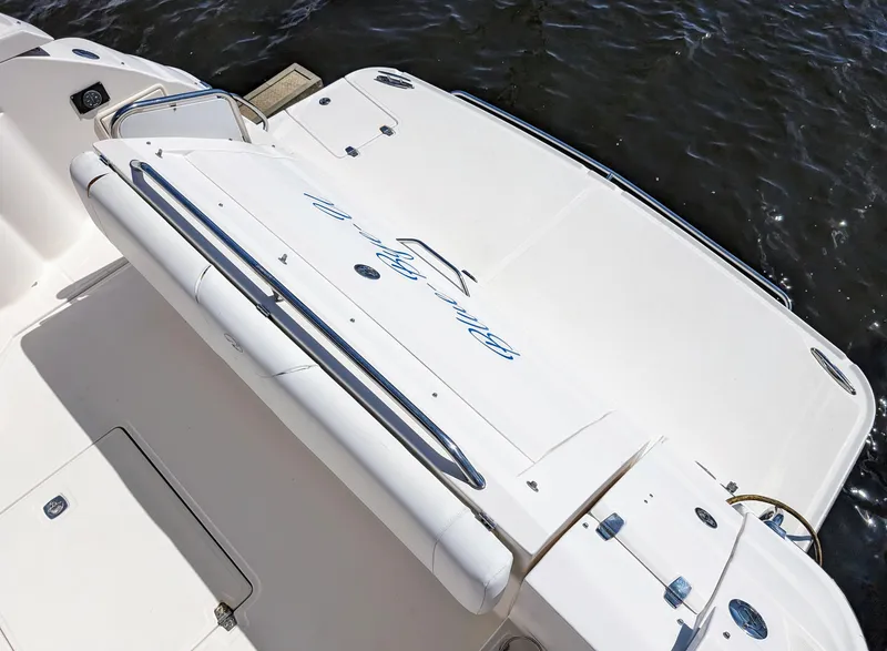 Slide: The Image of 2005 Regal 3560 boat deck with white finish and water backdrop. - 15