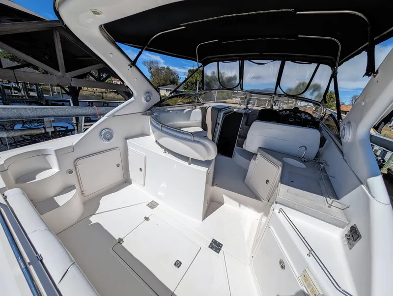 Slide: The Image of 2005 Regal 3560 yacht interior with seating, helm, and storage compartments. - 2
