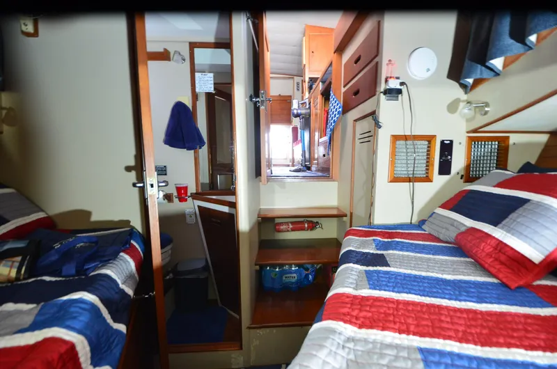 Slide: The Image of Interior of 1978 Grand Banks 36 Classic with twin beds and nautical decor. - 10