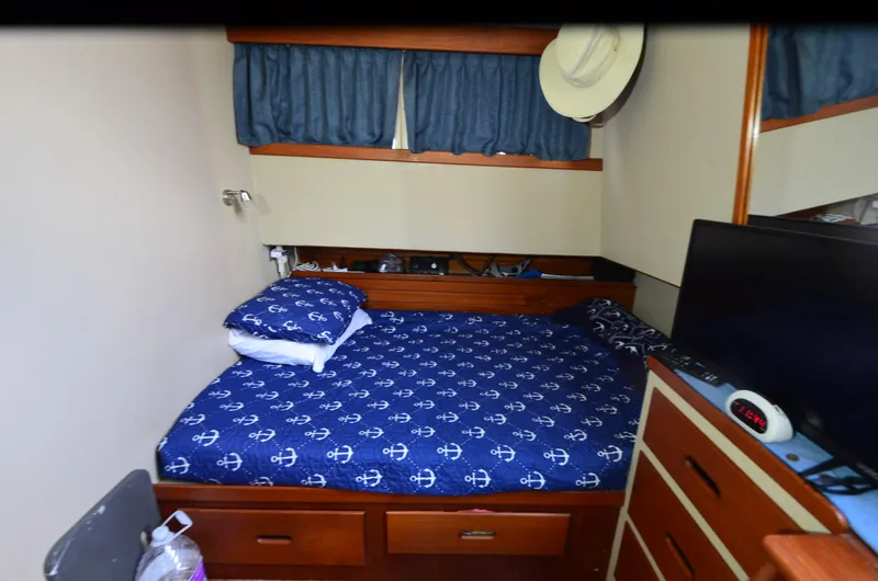 Slide: The Image of Cozy cabin interior of 1978 Grand Banks 36 Classic with nautical-themed bedding. - 19