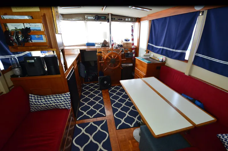 Slide: The Image of Interior of 1978 Grand Banks 36 Classic boat with red seating and nautical decor. - 21