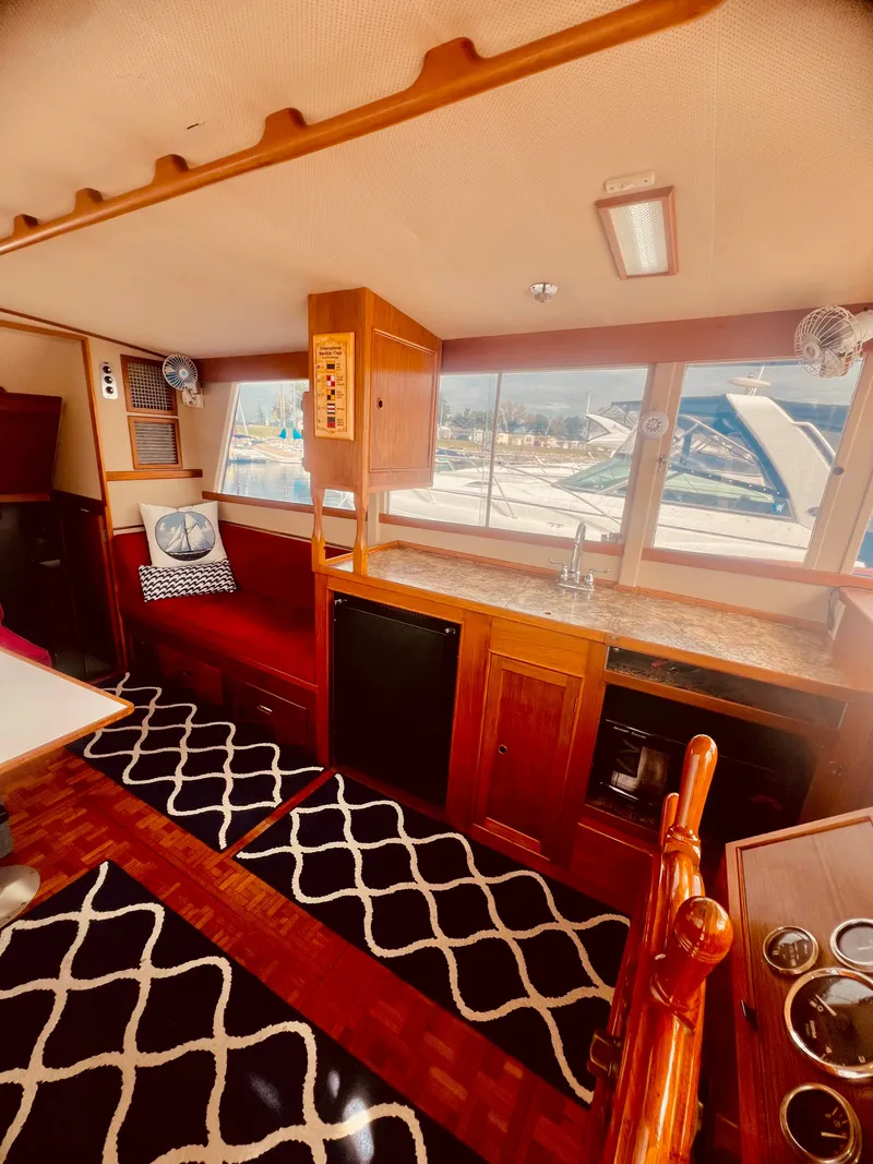 Slide: The Image of Interior of 1978 Grand Banks 36 Classic yacht with wood finish and nautical decor. - 26