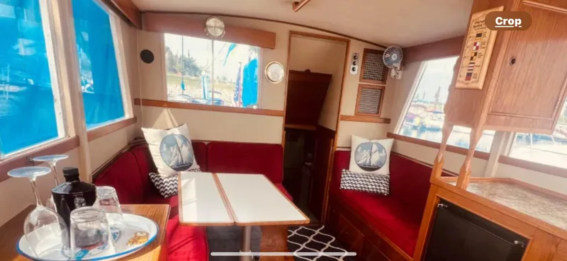 Slide: The Image of Interior of 1978 Grand Banks 36 Classic yacht with red seating and nautical decor. - 27