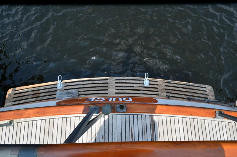 Slide: The Image of 1978 Grand Banks 36 Classic boat stern with wooden deck and water view. - 29
