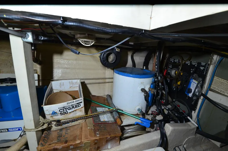 Slide: The Image of Engine room of 1978 Grand Banks 36 Classic with various equipment and wiring. - 46
