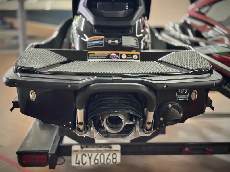 Slide: The Image of 2023 Kawasaki Jetski STX 160X rear view on trailer, showcasing engine and design details. - 4